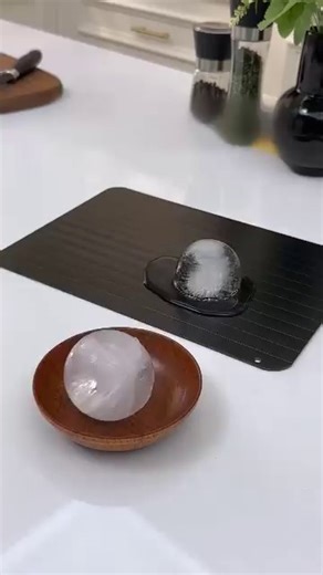 how fast defrost trays utilize conductive materials to accelerate the thawing process for various food items. discover the simple process of placing frozen ingredients on the tray's surface and observing how thermal transfer helps reduce thawing time. learn how to incorporate this tool into your kitchen routine for more efficient meal preparation 🥩🛠️ | The Smart Home Guide