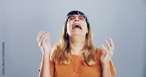 Sad, depression and woman crying in a studio with a broken heart after a breakup, divorce or bad news. Emotion, upset and female person with tears for grief, loss or bereavement by a gray background.