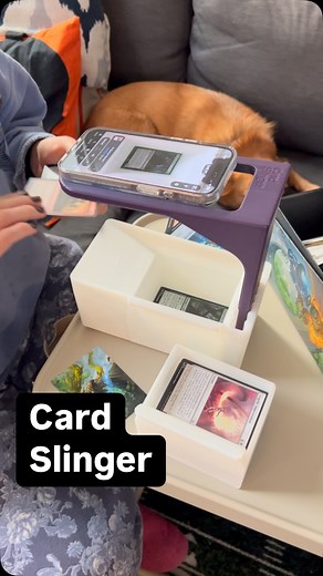 Card Slinger on Instagram: "Never has scanning been so easy! Get the all new and improved Card Slinger 5.0 today! Now with sliding drawer for easy card access, 9 color accents, and cute little feet! The Card Slinger is a first of its kind device to help you scan in un sleeved and sleeved MTG and TCG cards using scanning apps like ManaBox. Available for purchase or free 3d file download to print your own! Links in bio! #cardslinger #manabox #scan #scanner #mtgscanner #3dprinted #mtg #magicthegath