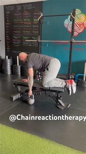 Straight arm bent over row kneeling on bench