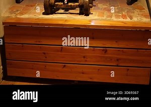 Dark stone prison inside a medieval castle, rusty bars, chains, and torch light illuminating the cold walls. Historical architecture and atmosphere of old confinement captured in 4K ultra HD.