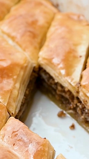 Recipe here: https://therecipecritic.com/baklava/ Phyllo pastry and walnuts are layered together then baked until the pastry is deliciously flaky. A sweet honey syrup is poured over the top which soaks into the baklava and makes every bite heavenly. | Tried and True Recipes