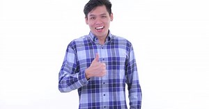 Enthusiastic Young Adult Gives Thumbs Up