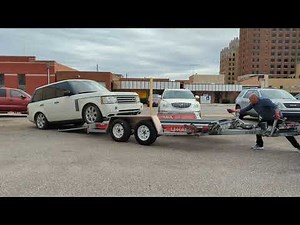 Loading the car in the hauler trailer using a manual lever hoist or come along.