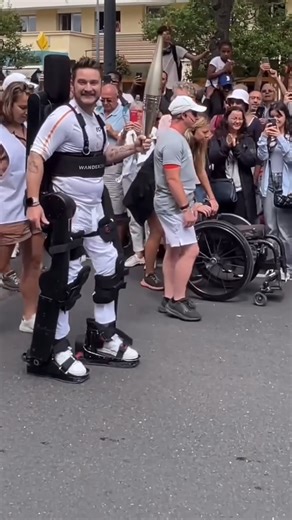 14M views · 373K reactions | French Paralympian Kevin Piette made history as he carried the Olympic flame through Paris while wearing a robotic exoskeleton.  (h/t @noxton78) | CBS Sports | Facebook