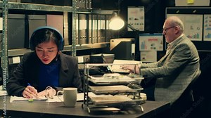 Private detective extracting important ideas from witness statements, taking notes based on classified documents. Forensic expert looks into archived legal documents, listens to music. Camera A.