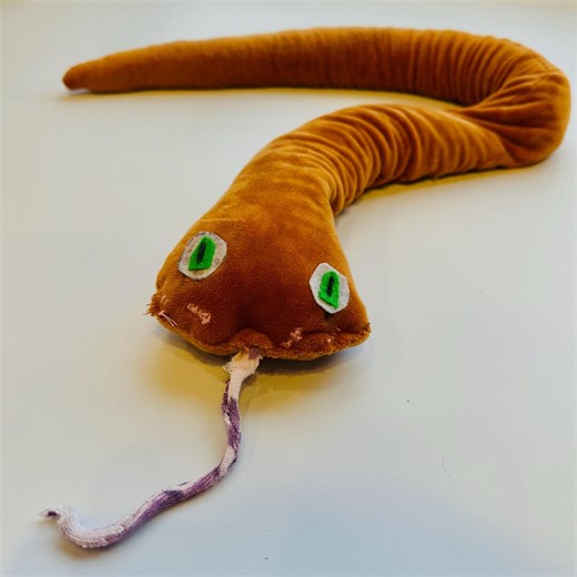 Rusty colored homemade weighted snake plush