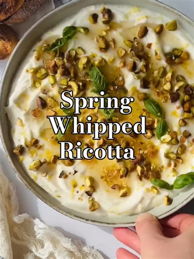 Spring Appetizer Series Episode 1: SPRING WHIPPED RICOTTA WITH PISTACHIOS & HONEY Easy, fresh, and so tasty. This easy appetizer comes together in 10 minutes INGREDIENTS FOR THE WHIPPED RICOTTA 2 cups (475g) full fat fresh ricotta cheese juice of half a lemon zest from one lemon, divided 1/4 tsp salt pinch ground pepper 1 tbsp olive oil TOPPINGS 3 tbsp liquid honey 1/4 cup chopped salted pistachios 2 tbsp minced fresh basil INSTRUCTIONS - 1. In a food processor add the ricotta, lemon juice, lemo