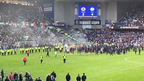 Watch: Fans clash on pitch after Celtic knock Rangers out of cup on penalties