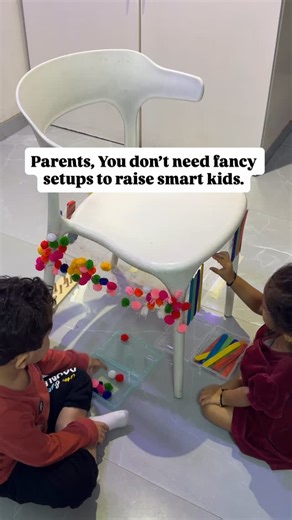 Vedh & Vaani on Instagram: "You don’t need a fancy sensory bin to raise a smart toddler. One chair. Four sides. Endless learning. 👶✨ Learning happens where you are, with what you have. 🤍 #toddleractivities #kidsactıvıtıes #fyp #taarezameenpar #explore toddler activities at home, simple learning activities for toddlers, easy toddler activities, learning through play, diy toddler activities, budget friendly toddler activities, no fancy toys parenting, smart parenting tips, toddler sensory play a