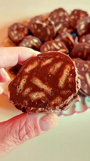 Chocolate biscuit log - Ingredients: • 2 cups Nova Choc-oh-late baking buttons • 5 tablespoons butter • 4 tablespoons milk • 1packet of tennis biscuits - Method: • Melt the chocolate, milk and butter and mix until smooth • break up the tennis biscuits in a bowl and pour the chocolate in, mix until the biscuits are completely mixed in • throw the mixture out onto baking paper and push it into the shape of a log with a spoon • roll the mixture up in the baking paper and put in the fridge to set fo