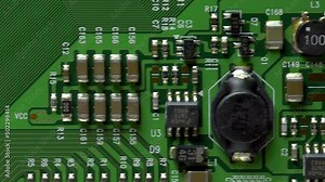 extreme close up of a green printed circuit board, Fly past.
