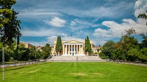 Zappeion building in National Gardens of Athens, Greece. Neoclassical architecture. White clouds move across the blue sky. Time lapse video.
