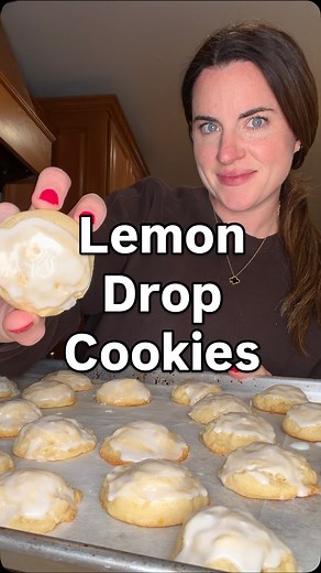 Lemon Drop cookies! Episode 29 of my Christmas cookie series! Ingredients: 1 cup granulated sugar 2 lemons, zested ¾ cup unsalted butter, room temperature 1 large egg 1 teaspoon vanilla extract 1 tablespoon lemon juice 2 & ¼ cups all purpose flour 1 teaspoon baking powder ¼ teaspoon salt Lemon Glaze 1 & ½ cups powdered sugar 3 tablespoons lemon juice How to: Start by adding granulated sugar and the zest of two lemons in a mixing bowl. Mix until well combined. Add in softened butter and mix well.