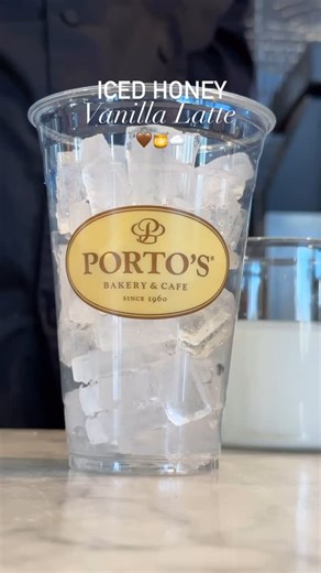 Porto's Bakery & Café on Instagram: "Iced Honey Vanilla Latte 🤎🍯☁️ Made with local wildflower honey. 🍯"