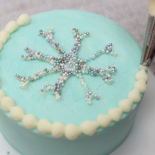 Make an easy paper stencil for this sparkly snowflake cake design! | British Girl Bakes