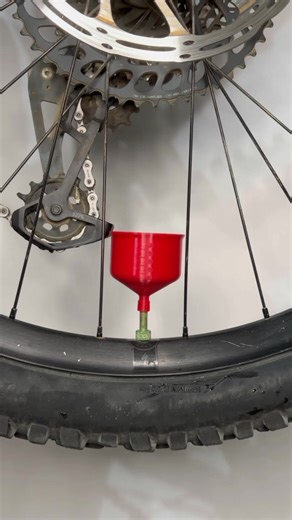 How to Add Tire Sealant with the Print My Ride Funnel – Step-by-Step Tutorial 1. Remove the valve cap and unscrew the Presta valve to release all the air. 2. Use a Presta core remover tool to carefully unscrew and remove the valve core. 3. Screw the Print My Ride funnel onto the valve — its flexible design makes for a secure fit. 4. Insert the plunger and pour in sealant up to the desired line. 5. Gently squeeze the tire to help draw the sealant in as you remove the plunger. 6. Remove the funnel