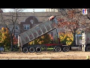 Dump Trucks & Tipper Trailer Trucks Of Homrich Inc. Dumping in Detroit, MI, USA, 2014.