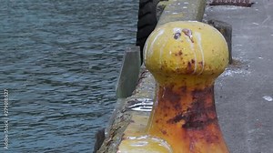 Large boat mooring bollard by port