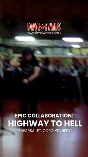 Dave Evans rehearses "Highway to Hell" with the Kennedy Choir