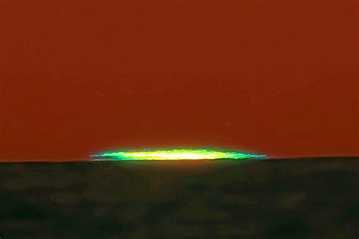 What is a 'green flash' and why does it happen?
