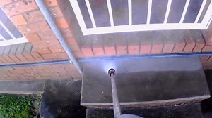 Refreshing Backyard Concrete with Pressure Washing from Start to Finish