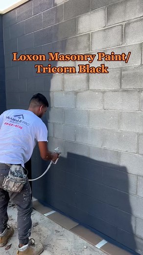 Did you know it’s crucial to use a masonry paint or stain for concrete and brick? Here we are painting CMU blocks using Loxon (masonry paint) in a tinted primer then finished in the color Tricorn Black. #masonrypaint #loxon #concreteblock #paintingbrick #exteriorpainting #foryoupage #satisfying #tricornblack