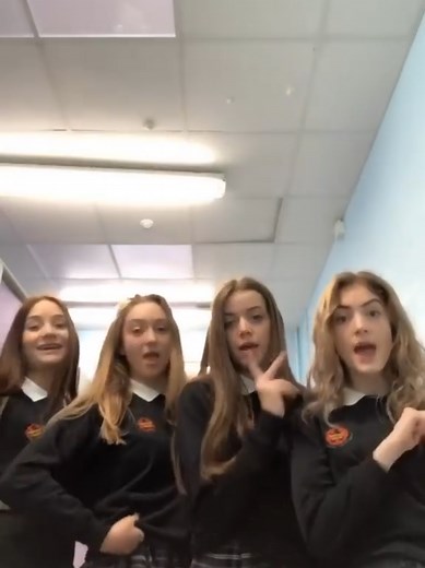 Girls Dancing in School Uniforms