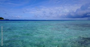 abstract tropical ocean, small waves, remote island, and crystal clear seawater background