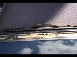 How to fix your sunshade when it detaches from the track for a 2009 Mini Cooper