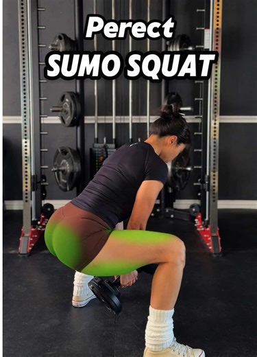 Dumbbell Sumo Squat - How to Target the Glutes App from @Fitbod App 1. Dumbbell Position Hold the dumbbell with both hands naturally hanging between your legs, rather than holding it at your chest. This allows you to lift heavier weights without being limited by arm strength. 2. Torso Posture Maintain a slight forward lean instead of staying fully upright. Leaning forward increases hip flexion, helping to stretch and better activate the glutes. 3. Stance Width and Foot Angle Set your feet about 