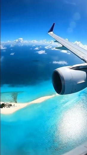 Airbus A318 flying low over the island