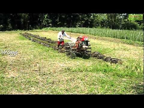 Kubota 2 Wheel Tractor Plowing Farm Field