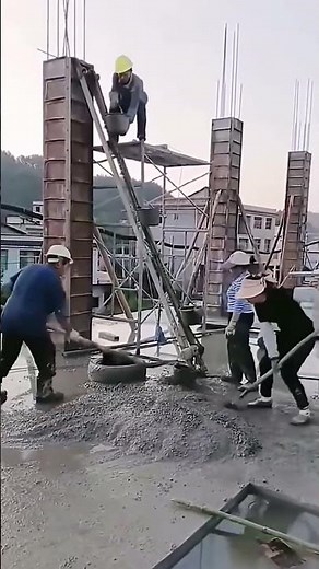 The process of manually pouring concrete into the column formwork