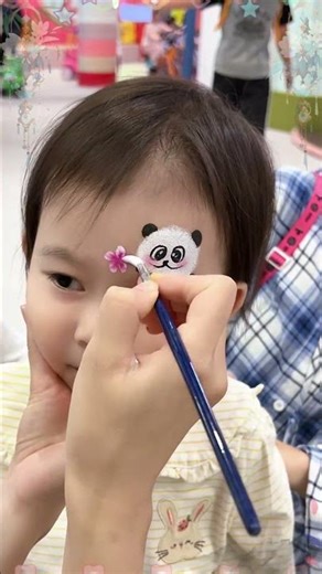Panda face painting is incredibly adorable and calming!