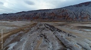Unique salty plain adjacent to the salt mountain known as the salt dome. High resolution and quality aerial footage.