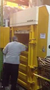 Operators using A-Ward bramidan X50 cardboard baler
