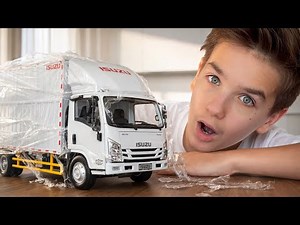 Mark shows Isuzu NPR Diecast Model Truck in 1 to 18 scale