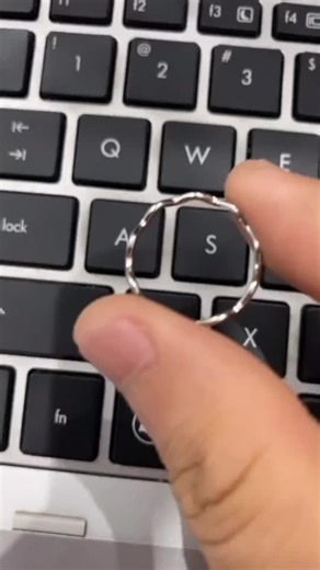 Close-Up Laptop Keyboard Interaction with Silver Ring