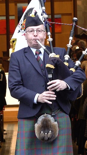 The lone piper, Pipe Major Alistair M Duthie, marches out of St John's Kirk, playing 'Flowers of the Forest'. This was during the 2025 Remembrance Sunday service in the City of Perth, Scotland. "They shall grow not old, as we that are left grow old: Age shall not weary them, nor the years condemn. At the going down of the sun and in the morning, We will remember them." #RemembranceSunday #remembranceday2025 #cityofperth #scotland | Scotland's Pipe Bands