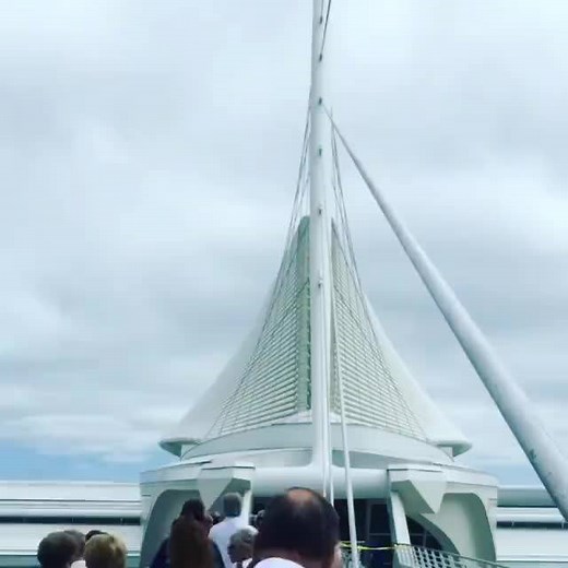 The Museum's signature wings, the Burke Brise Soleil, form a sun screen that can be raised and lowered creating a unique moving sculpture. The brise soleil spreads 217 feet at its widest point (wider than a Boeing 747-400 airplane!), and weighs 90 tons. | Milwaukee Art Museum