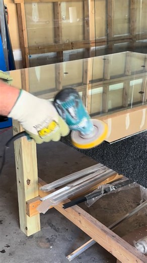 Corey Freeman sanding mirrors and getting them ready for install. We cut mirrors and install them. Looking for small or large mirrors? We got you covered. Call/Text for a free quote today. 251-232-0692. | Freeman Glass
