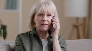 Portrait old caucasian woman angry senior lady furious frustrated annoyed mature female talking mobile phone calling conflict misunderstanding quarrel unpleasant conversation communication problems