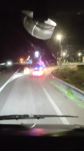 Nighttime Police Car Scene: Blue and Red Lights