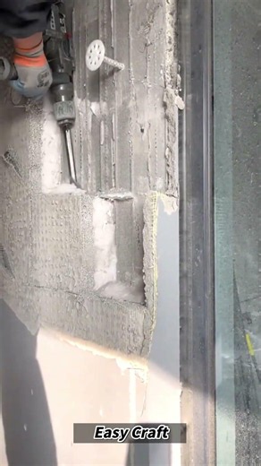 Manual Demolition of Wall Surface Using Power Chisel