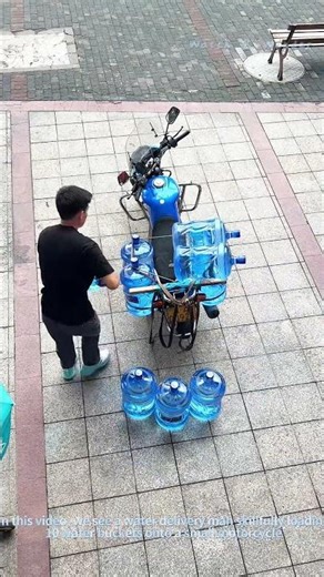 Delivery Man Skillfully Loads 10 Water Buckets onto a Small Motorcycle