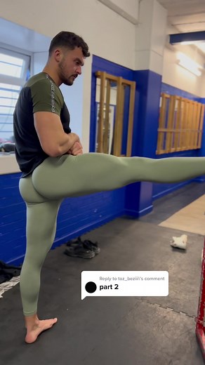 Men in White Leggings Stretching at the Gym
