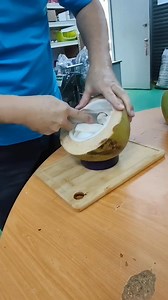 This tool is used to scrap young coconut flesh strips from the half-cut coconut. #cocoman #coconutmachine #coconutmachines #youngcoconutfleshscrapingtool #scraper | Lian Guan Chau