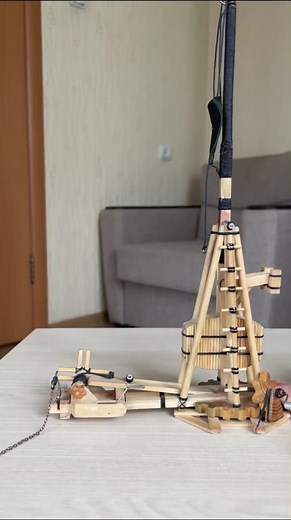 Handcrafted Wooden Crane Model in Action