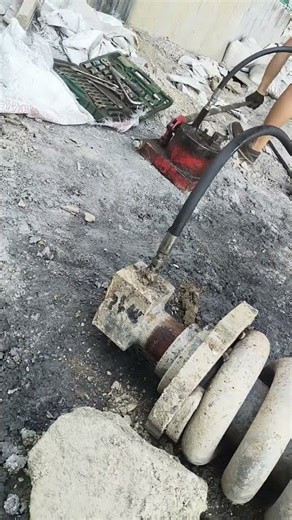 Press Homemade Hydraulic Pump To Unclog Rusted Excavator Track Grease Cylinder